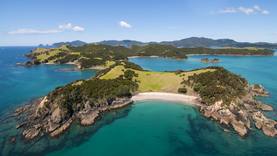 Aerial view of bays and white-sand beaches on Urapukapuka Island, part of the Bay of Islands at the tip of New Zealand&s North Island