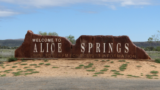 A &Welcome to Alice Springs& sign stands on the roadside in Australia&s Red Centre