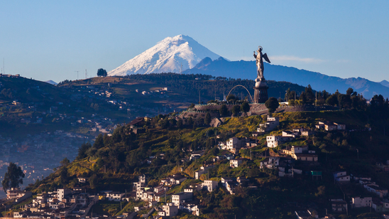 View of El Panecillo in the center of Quito with the Cotopaxi in the background