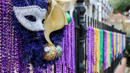 Mask and bead decorations outside a house celebrating Mardi Gras, USA